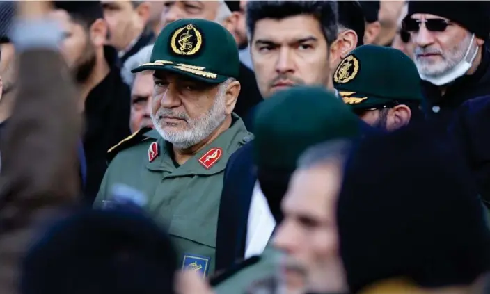  ?? Photograph: Anadolu/Getty Images ?? The IRGC commander-in-chief, Maj Gen Hossein Salami (centre, in green), said: ‘We hear some threats from American officials about targeting Iran. We tell them that you tested us and we know each other.’