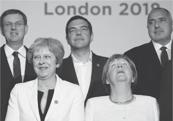  ?? LEON NEAL / AFP / GETTY IMAGES ?? From left, Slovenia’s Prime Minister Miro Cerar, Britain’s Prime Minister Theresa May, Greece’s Prime Minister Alexis Tsipras, Germany’s Chancellor Angela Merkel and Bulgaria’s Prime Minister Boyko Borissov prepare to take part in the family photo...