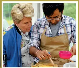  ??  ?? Brushing up: Sandi Toksvig inspects his Chelsea buns