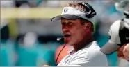  ?? AP PHOTO BY LYNNE SLADKY ?? In this Sunday, Sept. 23, file photo, Oakland Raiders head coach Jon Gruden works the sideline during the first half of an NFL football game against the Miami Dolphins in Miami Gardens, Fla.