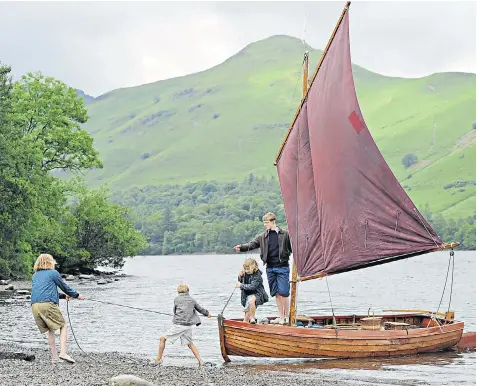  ??  ?? Left, the 1974 Swallows and Amazons film. Right, this year’s hi-tech version, which VisitEngla­nd hopes will inspire tourists to visit the locations where it was filmed