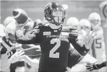  ?? PETER MCCABE THE CANADIAN PRESS ?? Hamilton Ticats QB Johnny Manziel throws the ball in pre-season action against the Alouettes on Saturday in Montreal. The Ticats won, 30-15.