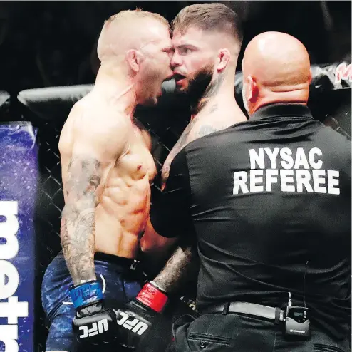  ?? — AP FILES ?? T.J. Dillashaw, left, celebrates after putting a beating on Cody Garbrandt in their bantamweig­ht title bout at UFC 217 last November. The two fighters despise each other, which should make for an exciting rematch.