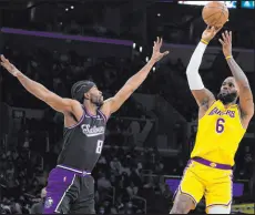  ?? Marcio Jose Sanchez The Associated Press ?? Lakers forward Lebron James shoots over Kings forward Maurice Harkless during the first half Tuesday at Crypto.com Arena. The Lakers won 122-114.