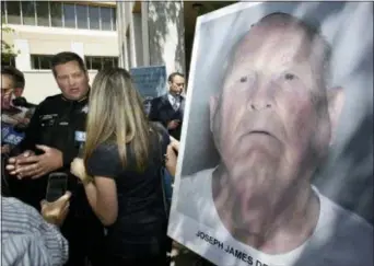  ?? RICH PEDRONCELL­I — THE ASSOCIATED PRESS ?? Sacramento County Sheriff Scott Jones, left, talks to reporters about the arrest Joesph James DeAngelo, seen in photo, on suspicion of committing a string of violent crimes in the 1970’s and 1980’s after a news conference Wednesday in Sacramento. A DNA...