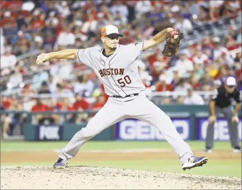  ?? Rob Carr / Getty Images ?? AL pitcher Charlie Morton of the Houston Astros and delivers during the seventh inning against the National League during the 89th MLB All-Star Game at Nationals Park on Tuesday.