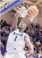  ?? GERRY BROOME/ASSOCIATED PRESS ?? Duke’s Zion Williamson (1) dunks in the top-ranked Blue Devils’ runaway win over Eastern Michigan on Wednesday night.