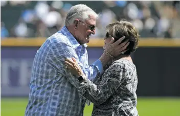 ?? NAM Y. HUH/AP ?? Hawk Harrelson embraces wife Aris on ‘‘Hawk Day’’ on Sept. 2, 2018, at Guaranteed Rate Field.