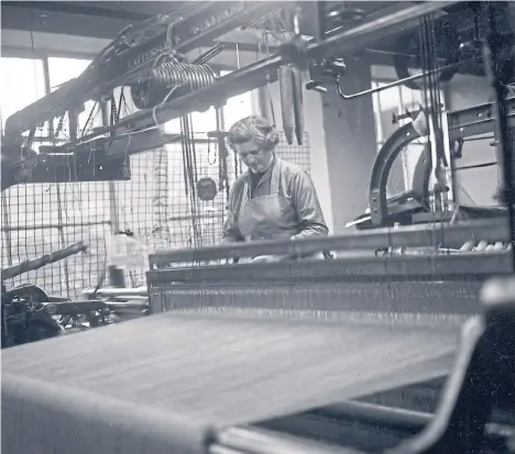  ??  ?? The Milladen wool mills of JC Rennie have given employment to folk from Stuartfiel­d for well over a century. Mrs Margaret Cooper at work on one of the weaving looms