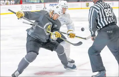  ?? AP PHOTO ?? Vegas Golden Knights’ William Karlsson, left, and Vadim Shipachyov face off in a scrimmage game during NHL team practice at City National Arena on Sept. 15 in Las Vegas.