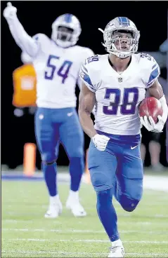  ?? AL BELLO/GETTY IMAGES ?? Jamal Agnew of the Detroit Lions returns a punt 88 yards for a touchdown in the fourth quarter against the New York Giants.