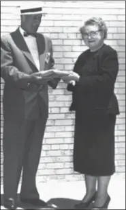  ?? ?? Crawford receives donations as 1956 Cancer Drive leader