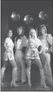  ?? Adrian Dennis/afp-getty Images ?? Madame Tussauds waxwork ABBA models sport replica outfits worn in their 1975 hit SOS.