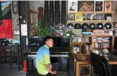  ?? ?? Finding his voice: Zu sitting in front of a piano during a break from a practice session at the music studio in beijing. — reuters