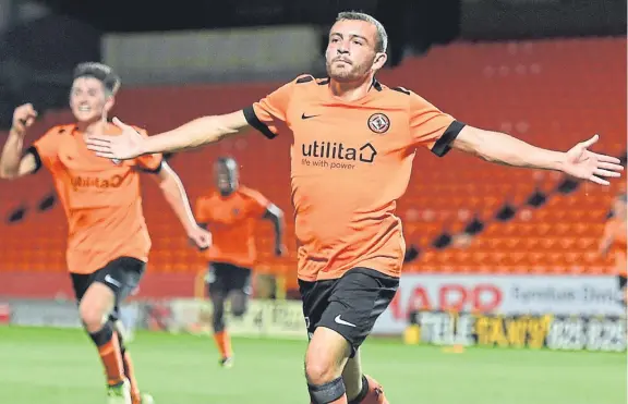  ?? Picture: SNS Group. ?? Paul McMullan celebrates after netting United’s winner in last night’s tie at Tannadice.