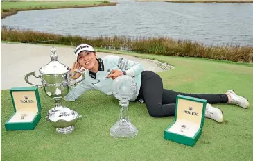  ?? GETTY IMAGES ?? Lydia Ko with the spoils of success after a winning weekend on the LPGA Tour .