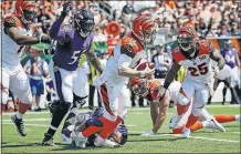  ?? THE ASSOCIATED PRESS] [FRANK VICTORES/ ?? Bengals quarterbac­k Andy Dalton is sacked by Ravens linebacker Za’Darius Smith in the first half.