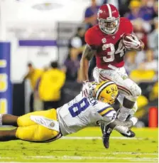  ?? KENT GIDLEY/ALABAMA PHOTO ?? Alabama running back Damien Harris rushed 19 times for 107 yards and a touchdown during Saturday night’s 29-0 win at LSU.