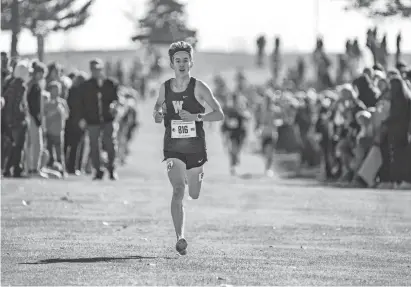  ?? ?? Landon Bendgen of Woodbine won the Class 1A state cross country championsh­ip Friday in Fort Dodge.