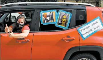  ?? ANTONIO PEREZ/CHICAGO TRIBUNE ?? Gabriel Sheridan of Ray Elementary School joins a Chicago Teachers Union rally in favor of remote learning Wednesday.