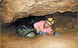  ?? SUSAN MONTOYA BRYAN/AP 2008 ?? Biologist Penny Boston, crawling through a cave in New Mexico, presented findings about microbes, which might be 50,000 years old, trapped in crystals in Mexico.