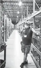  ?? AUTO PARTS ADVANCE ?? Steven Pierce, who was born deaf, was hired earlier this year by Advance Auto Parts at its distributi­on center in Delaware. While working there, he uses a radio frequency device on his wrist to locate parts from inventory.