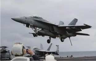  ?? —AP ?? A US Navy’s F/A-18 Super Hornet fighter approaches the deck of the Nimitz-class aircraft carrier USS Carl Vinson during the annual joint military exercise called Foal Eagle between South Korea and the United States at an unidentifi­ed location in the...