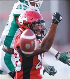  ?? CP PHOTO LARRY MACDOUGAL ?? Saskatchew­an Roughrider­s' Jovon Johnson, top, prevents Calgary Stampeders' Kamar Jorden from making a catch during first half CFL football action in Calgary on Saturday.