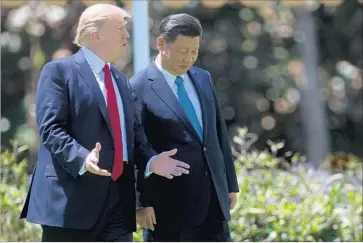  ?? Jim Watson AFP/Getty Images ?? PRESIDENT TRUMP, with Chinese President Xi Jinping on Friday, says he believes China hasn’t been manipulati­ng its currency for months and that labeling it a manipulato­r might jeopardize talks on North Korea.