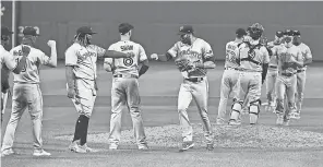  ??  ?? The Blue Jays celebrate a win over the Red Sox at Fenway Park. They are 5- 8 as they come to Buffalo for their first “home” game. BOB DECHIARA/ USA TODAY SPORTS