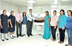  ??  ?? At the ceremony to hand over the medical equipment purchased with funds from the ‘Little Lives’ fundraiser at the new building of the De Soysa Hospital for Women. From left:Special Grade Nursing Officer W.D.P.L. Jeewandara, Special Grade Nursing Officer M.M.D. Dinesha Tharangani, Consultant Neonatolog­ist Dr. Nalin Gamaathige, Consultant Neonatolog­ist Dr. Nishani Lucas and Director Dr. Sudath Dharmarath­na from DSHW and Dr. Ashwini de Abrew, Thushanthi Ponweera, Amila Jayamaha and Marianne Davidfrom the ‘Little Lives’ team handing over the Double Surface Photothera­py Machine