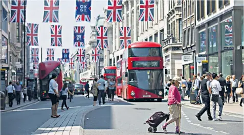  ??  ?? The effects of a weaker pound will be felt on the high street but not evenly. Clothing prices will rise more slowly than the cost of petrol or imported foodstuffs