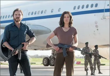  ??  ?? (Daniel Bruhl) and Brigitte Kuhlmann (Rosamund Pike) are German militants who hijack an Air France airliner in 1976 in Jose Padilha’s docu-drama