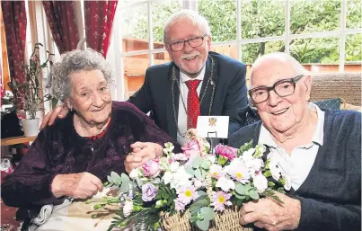  ?? Picture: Mhairi Edwards. with Richard Burdge ?? Jean and Donald Scott, both 96, celebratin­g their 76th wedding anniversar­y with Perth and Kinross Provost Dennis Melloy. Their longevity is proving to be a repeated pattern.