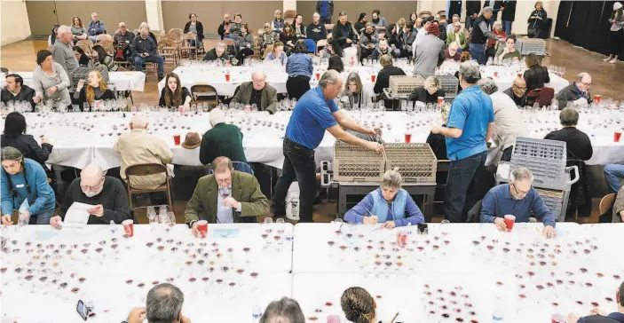  ?? PHOTOS BY MICHAEL SHORT ?? The blind judging included 66 judges from all aspects of the wine industry, including media, restaurant and hospitalit­y, education, winemaking and retail.