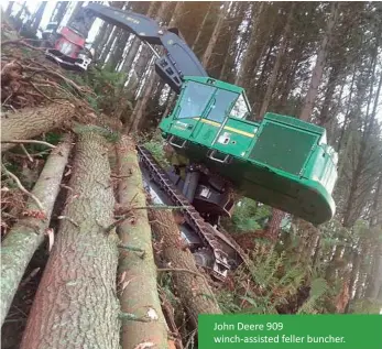  ?? ?? John Deere 909 winch-assisted feller buncher.