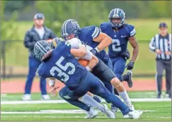  ?? Steven eckhoff ?? Berry’s Jake Weitkamp (35) and a teammate wrap up a Birmingham-Southern player to combine for a tackle-for-loss during Saturday’s game.