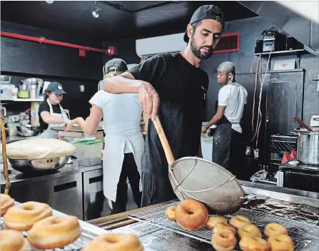  ?? GALIT RODAN THE CANADIAN PRESS ?? Jiten Grover, owner of Dipped Donuts, knew the power social media stars possess to boost the profile of a business in the food industry.