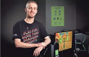  ?? MICHAEL CLEMENTS/UNT VIA AP ?? Michael Mairs, shown in the Media Library at the University of North Texas in Denton, Texas, raises thousands of dollars for St. Jude Children’s Research Hospital by playing video games online as “Smirky.”