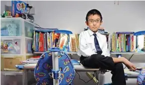  ??  ?? Math whiz: Koh taking a break after studying at his home. He is preparing for the IGCSE additional maths exam in June. — The Straits Times / Asia News Network