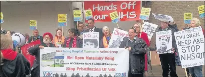  ??  ?? n PROTEST: Around 80 people including GLA member Onkar Sahota gathered outside the meeting at Greenford Hall on Wednesday ahead of the decision to approve the closure of the children’s ward which has been condemned as ‘disgusting’