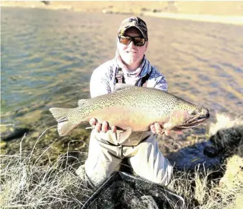  ?? Picture: SUPPLIED ?? COOL CATCH: Local teacher and event committee member Darren Boucher with his catch during the annual fly fishing event in Komani