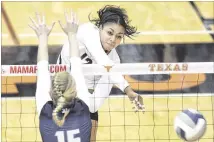  ?? ERICH SCHLEGEL / CONTRIBUTE­D ?? In her Texas debut, freshman Morgan Johnson (top) fifinished with six kills during Friday’s victory over Rice.