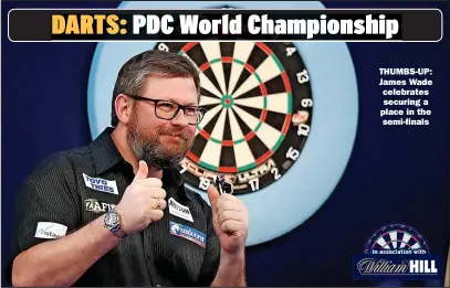  ?? ?? THUMBS-UP: James Wade celebrates
securing a place in the
semi-finals