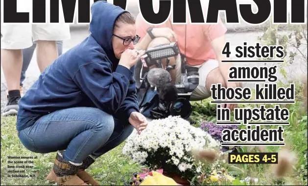  ??  ?? Woman mourns at the scene of the limo crash near restaurant in Schoharie, N.Y.