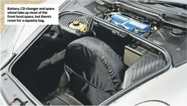  ??  ?? Battery, cD changer and spare wheel take up most of the front boot space, but there’s room for a squashy bag.