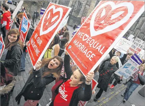  ??  ?? MAKING THEMSELVES HEARD: Members of the Scottish Youth Parliament demonstrat­ing and, below, Hamira Khan, who heads the organisati­on. Picture: Stewart Attwood