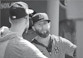  ?? MARY SCHWALM/AP PHOTO ?? Boston Red Sox second baseman Dustin Pedroia talks with pitcher Matt Barnes, left, in the dugout before the start of Monday’s game against the Cleveland Indians at Boston.