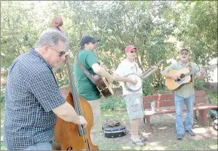  ??  ?? Prairie Grove Chamber brought back an old tradition in 2017 called 2nd Saturday Trades Day. It featured live music, including Porchlight Symphony which played at Mock Park in August.