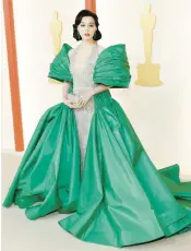  ?? MIKE COPPOLA/GETTY ?? Fan Bingbing wore Tony Ward Couture with her hair sculpted into an old Hollywood bob.